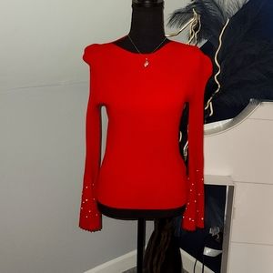 RED SWEATER WITH PEARL SLEEVES